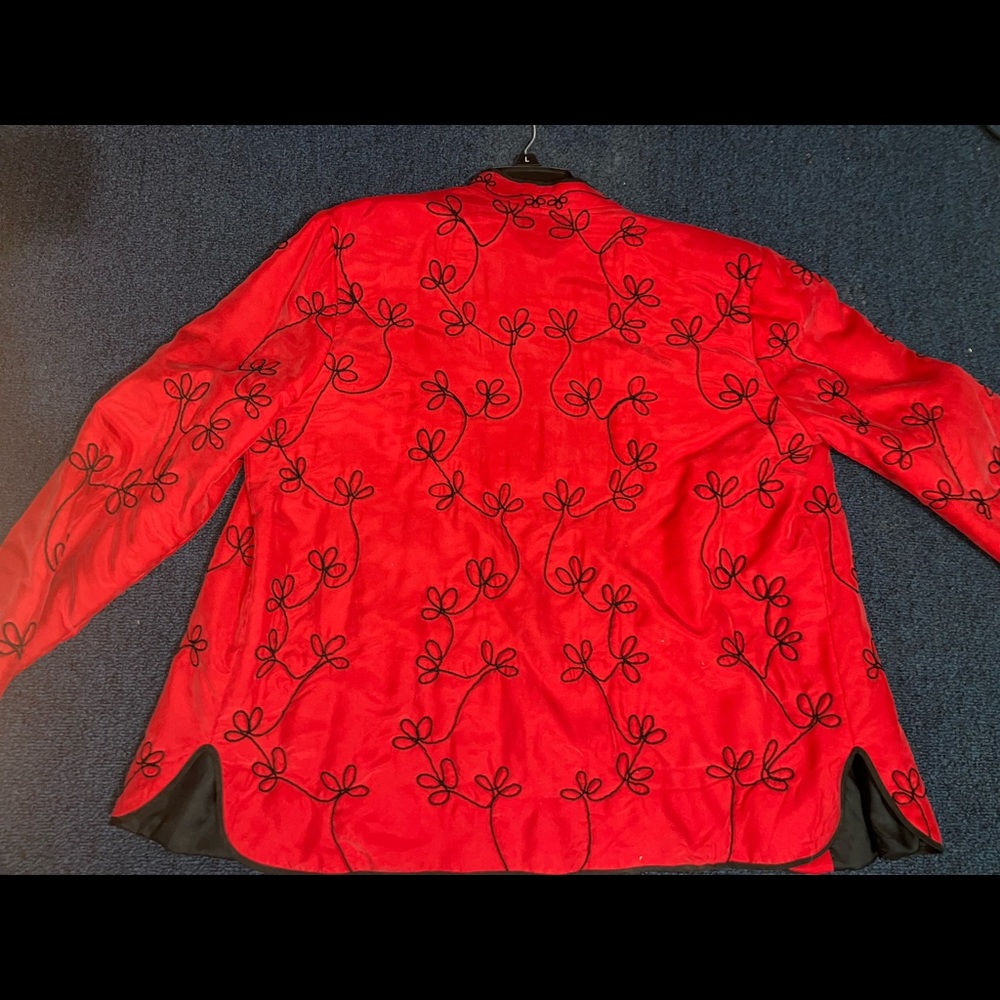 Red zip up with unique designs